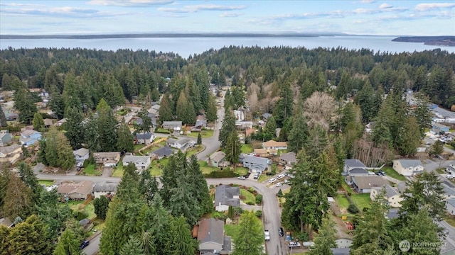 birds eye view of property with a residential view and a water view