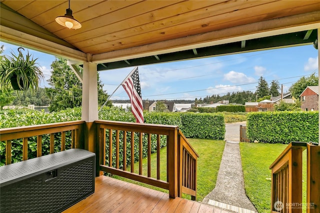 deck featuring a lawn