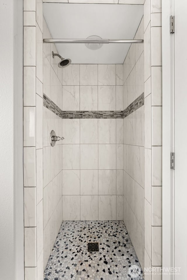 full bath featuring a shower stall