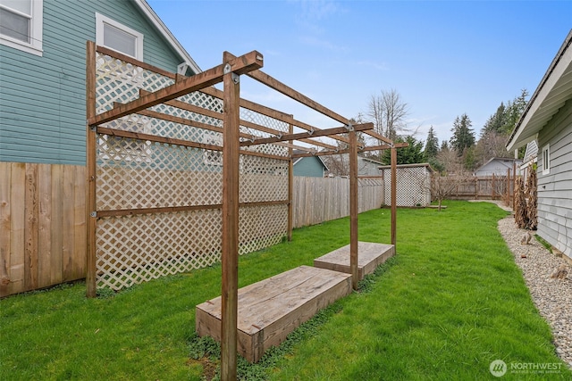 view of yard with a pergola and a fenced backyard