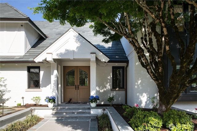 property entrance featuring brick siding