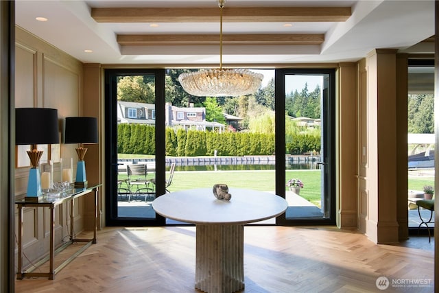 dining room featuring a wealth of natural light and beamed ceiling