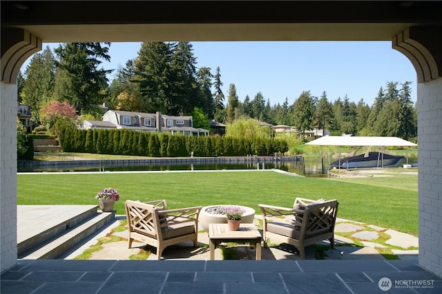 view of patio with a water view