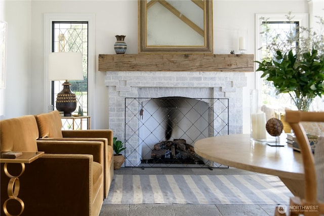 interior space with plenty of natural light and a fireplace