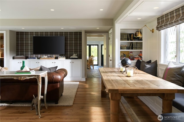 dining space with wallpapered walls, recessed lighting, and wood finished floors