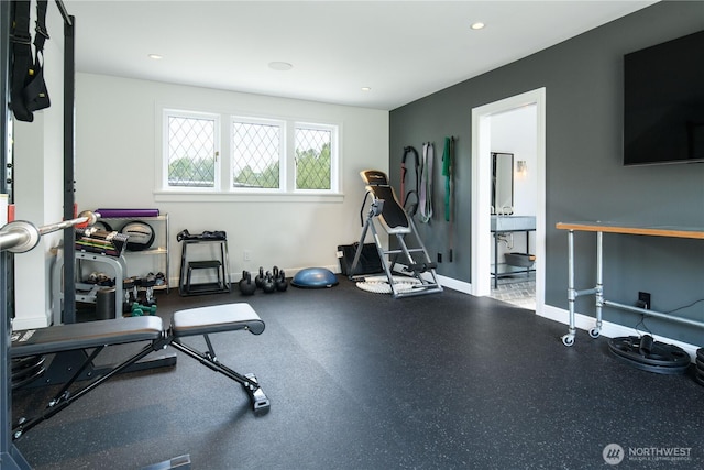 exercise area with recessed lighting and baseboards