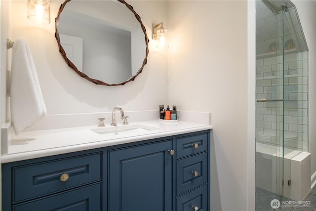 full bath with a shower stall and vanity