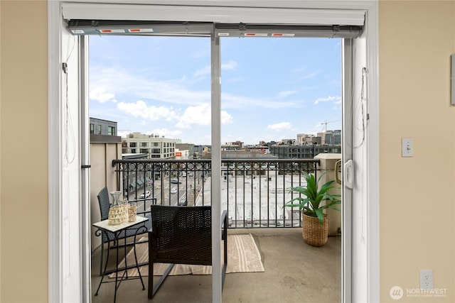 balcony with a view of city and a water view