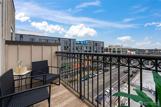 balcony featuring a city view