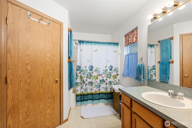 bathroom featuring vanity, tile patterned floors, and shower / tub combo with curtain