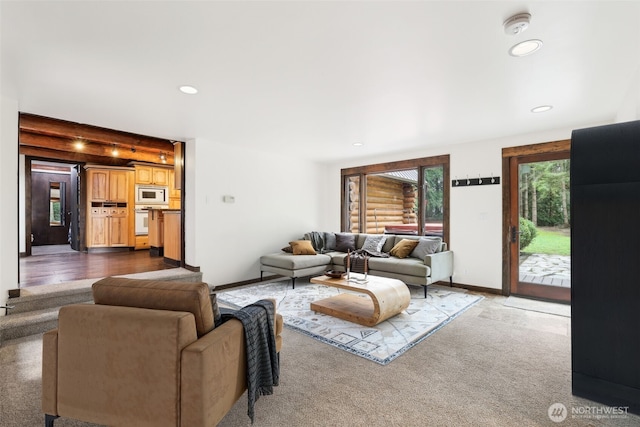 living area featuring carpet flooring, recessed lighting, and baseboards