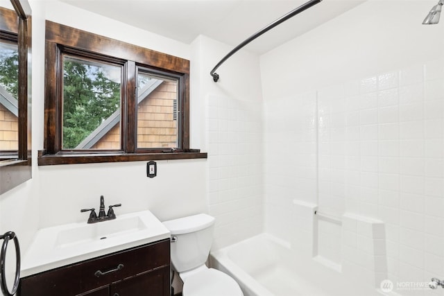 full bathroom featuring vanity, toilet, and bathtub / shower combination