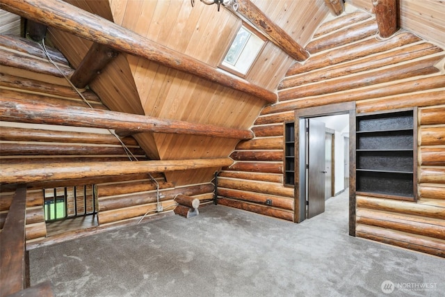 interior space featuring beamed ceiling, high vaulted ceiling, carpet floors, a skylight, and wooden ceiling