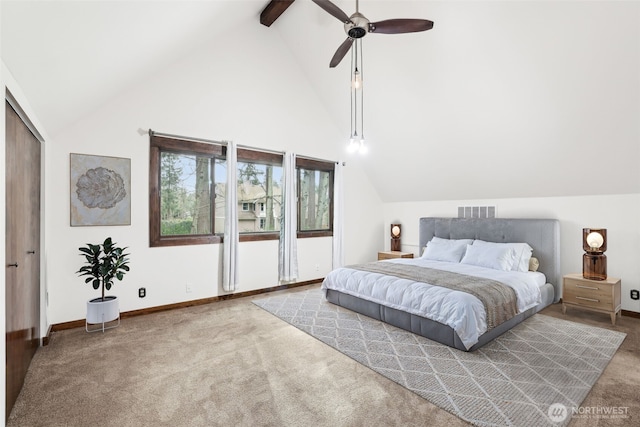 bedroom featuring visible vents, beamed ceiling, baseboards, and carpet