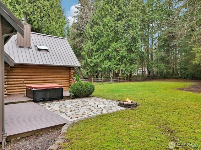 view of yard with a patio area, a wooden deck, and fence