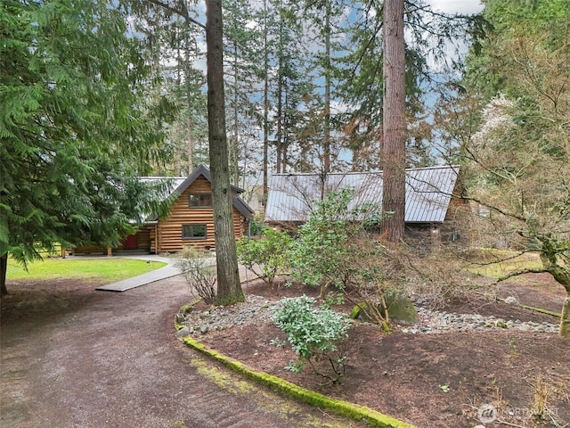 view of front of home featuring log siding