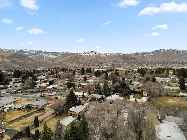 drone / aerial view featuring a mountain view and a residential view