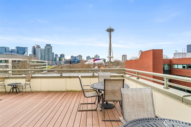 wooden deck featuring a city view