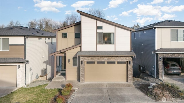 view of front of home featuring an attached garage and concrete driveway