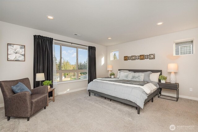 bedroom with recessed lighting, baseboards, and carpet floors