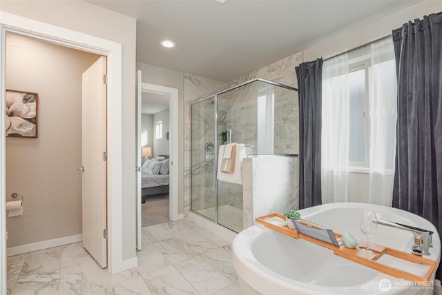 bathroom with a bathtub, a shower stall, marble finish floor, and baseboards