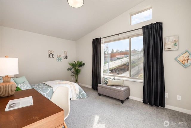 carpeted bedroom featuring baseboards and vaulted ceiling