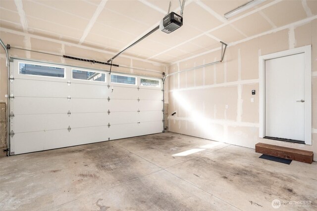 garage featuring a garage door opener