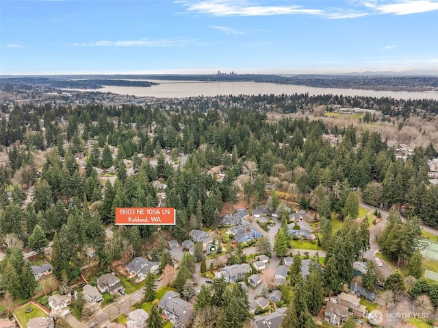 bird's eye view featuring a water view and a residential view