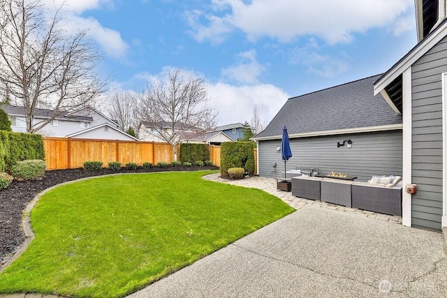 view of yard with an outdoor living space, fence private yard, and a patio