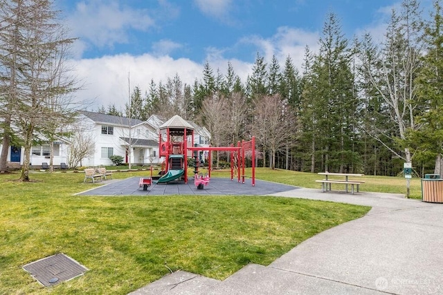 community play area with a lawn