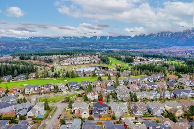 bird's eye view featuring a residential view and a water and mountain view