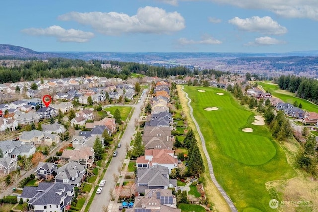 aerial view with a residential view and view of golf course