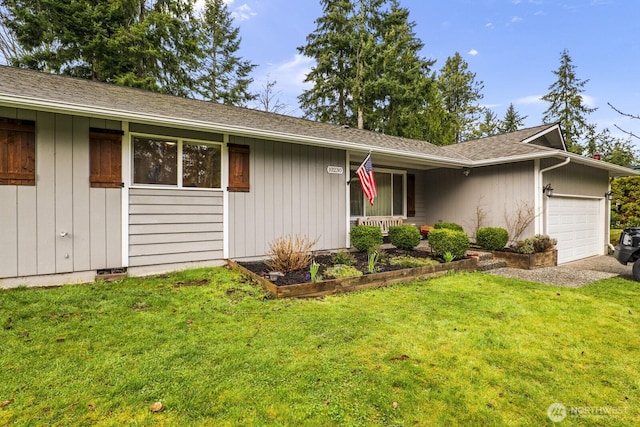 ranch-style home featuring a garage, a front yard, and a shingled roof