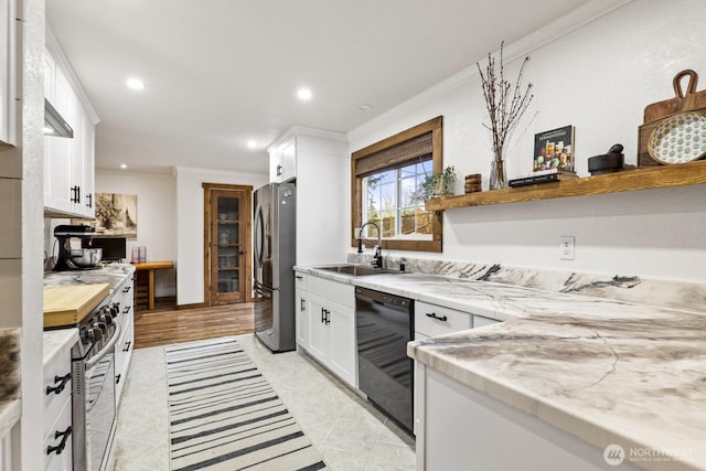 kitchen featuring recessed lighting, a sink, stainless steel appliances, white cabinets, and crown molding