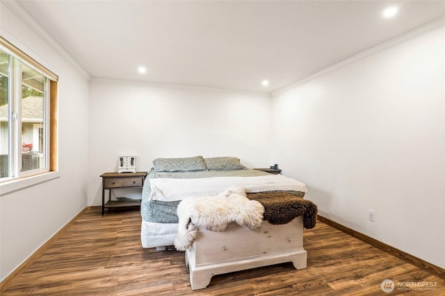 bedroom with recessed lighting, ornamental molding, baseboards, and wood finished floors