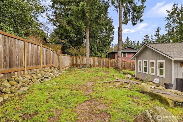 view of yard with a fenced backyard