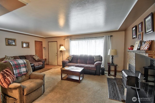 living area with carpet and a fireplace