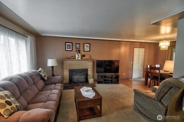 living room featuring an inviting chandelier and carpet floors