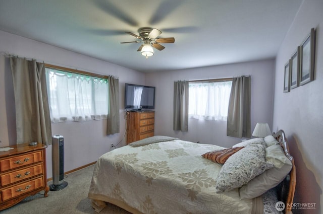 bedroom featuring baseboards, carpet floors, and ceiling fan