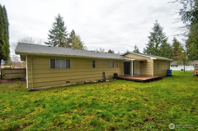 back of house featuring crawl space, a yard, and a deck