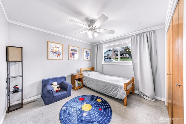 bedroom with baseboards, visible vents, carpet floors, and ornamental molding