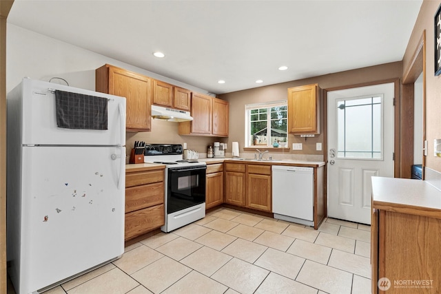 kitchen featuring under cabinet range hood, recessed lighting, white appliances, light tile patterned flooring, and light countertops