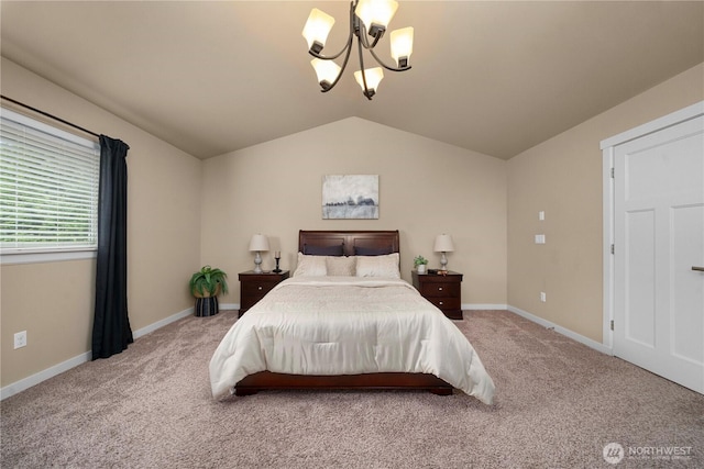 carpeted bedroom with a notable chandelier, baseboards, and vaulted ceiling