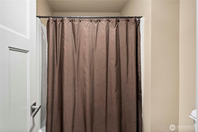 bathroom with curtained shower