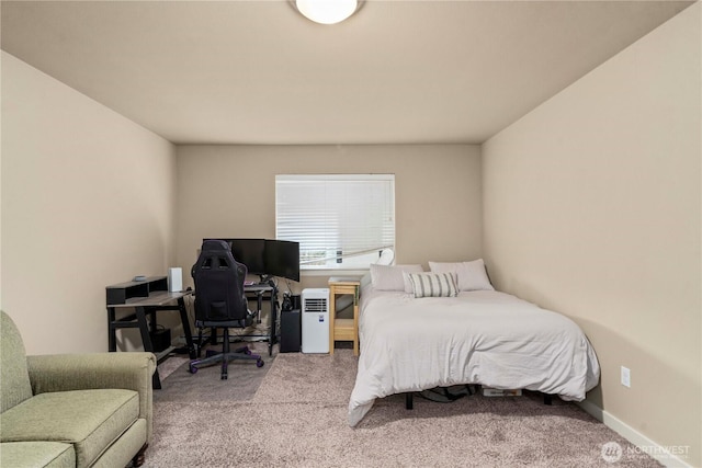 carpeted bedroom featuring baseboards