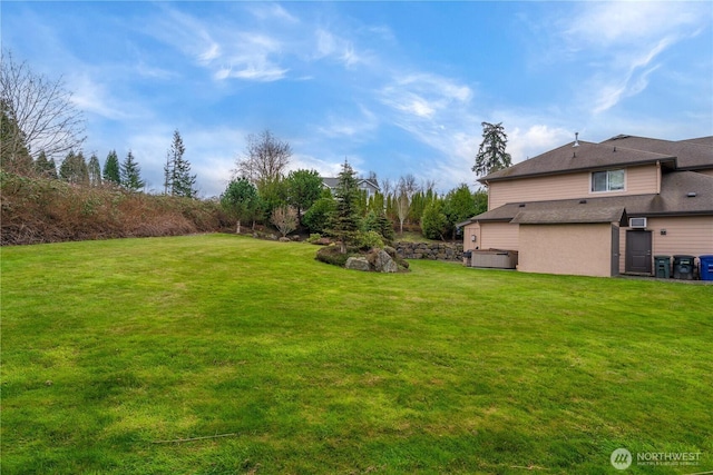 view of yard featuring central AC