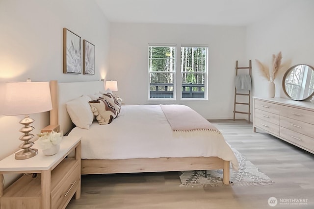 bedroom with light wood-style flooring