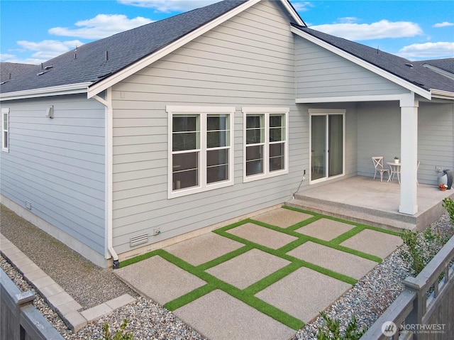 rear view of house with a patio