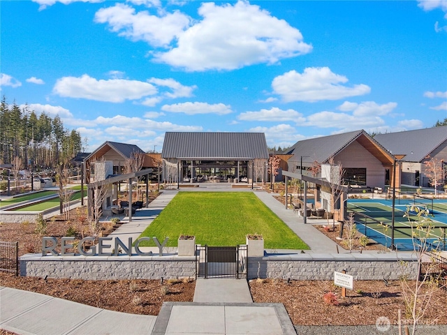 surrounding community with a yard, a gate, and a fenced front yard