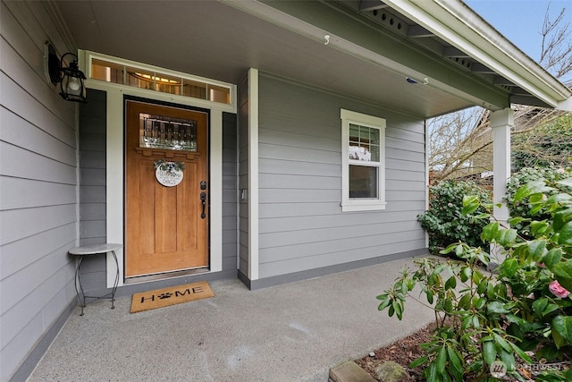 doorway to property featuring a porch